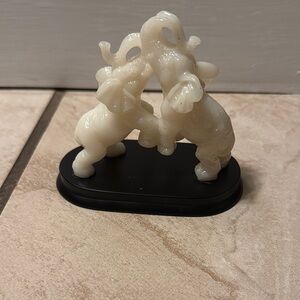 Elephant figurine on wooden stand Glow in The Dark